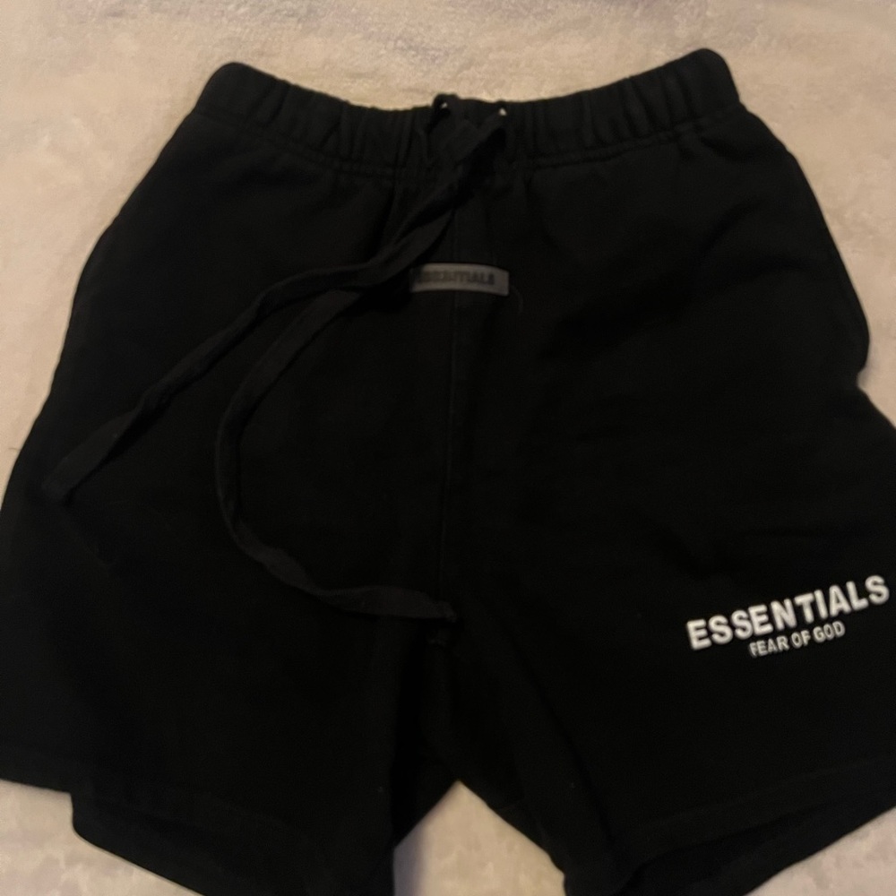 Black Fear of God Essentials shorts fits like medium